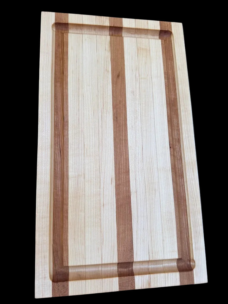 Wooden cutting board with a striped pattern on a dark background