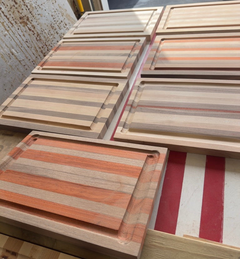 Wooden cutting boards with striped pattern on a striped surface