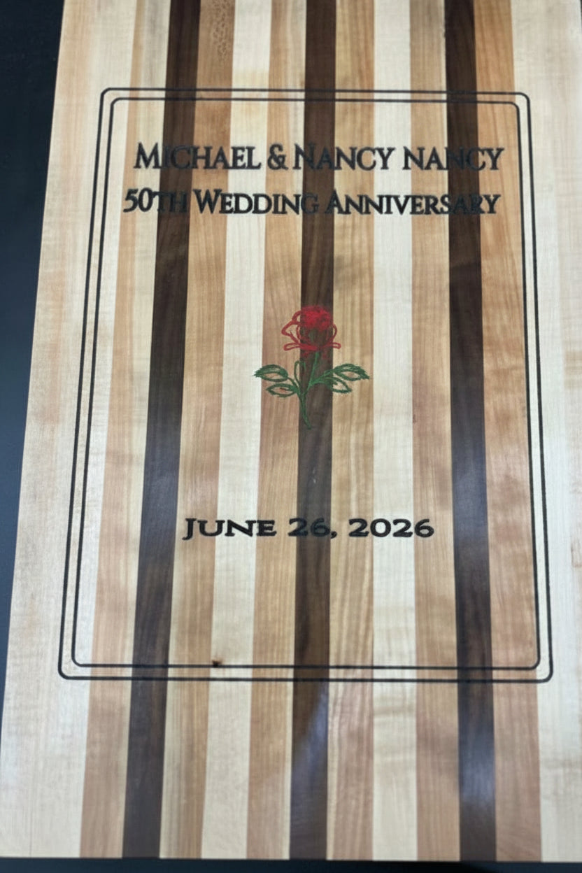 Wooden plaque with engraved text and a rose design on a dark background