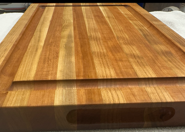 Wooden cutting board with a visible grain pattern