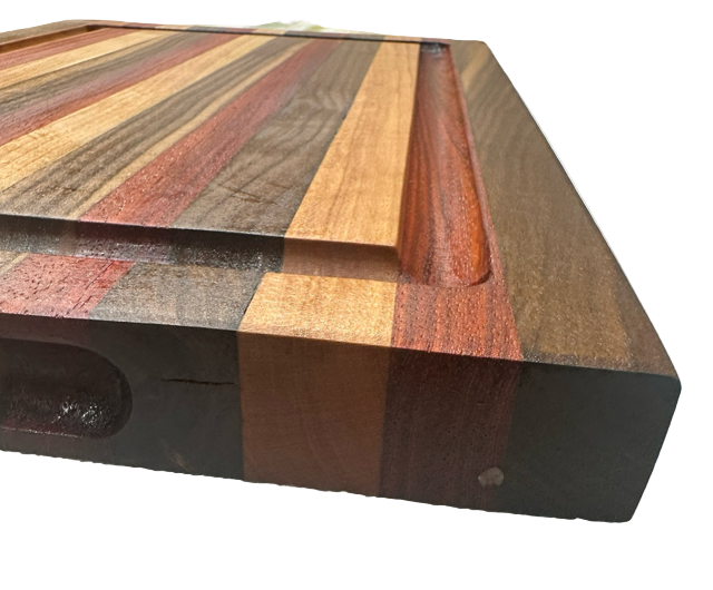 Wooden cutting board with multicolored grain pattern on a textured surface