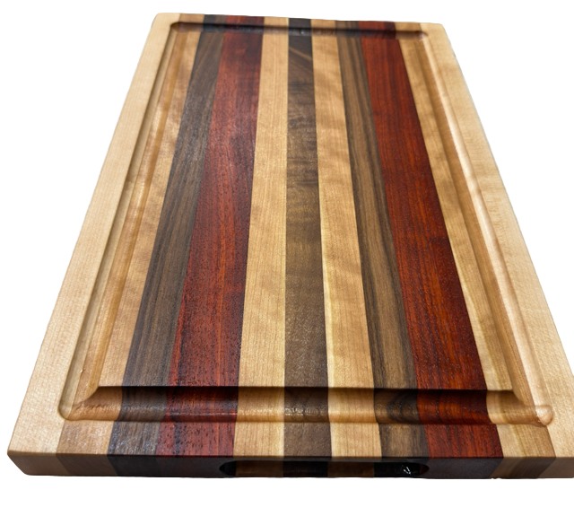 Wooden cutting board with multicolored stripes on a light gray surface