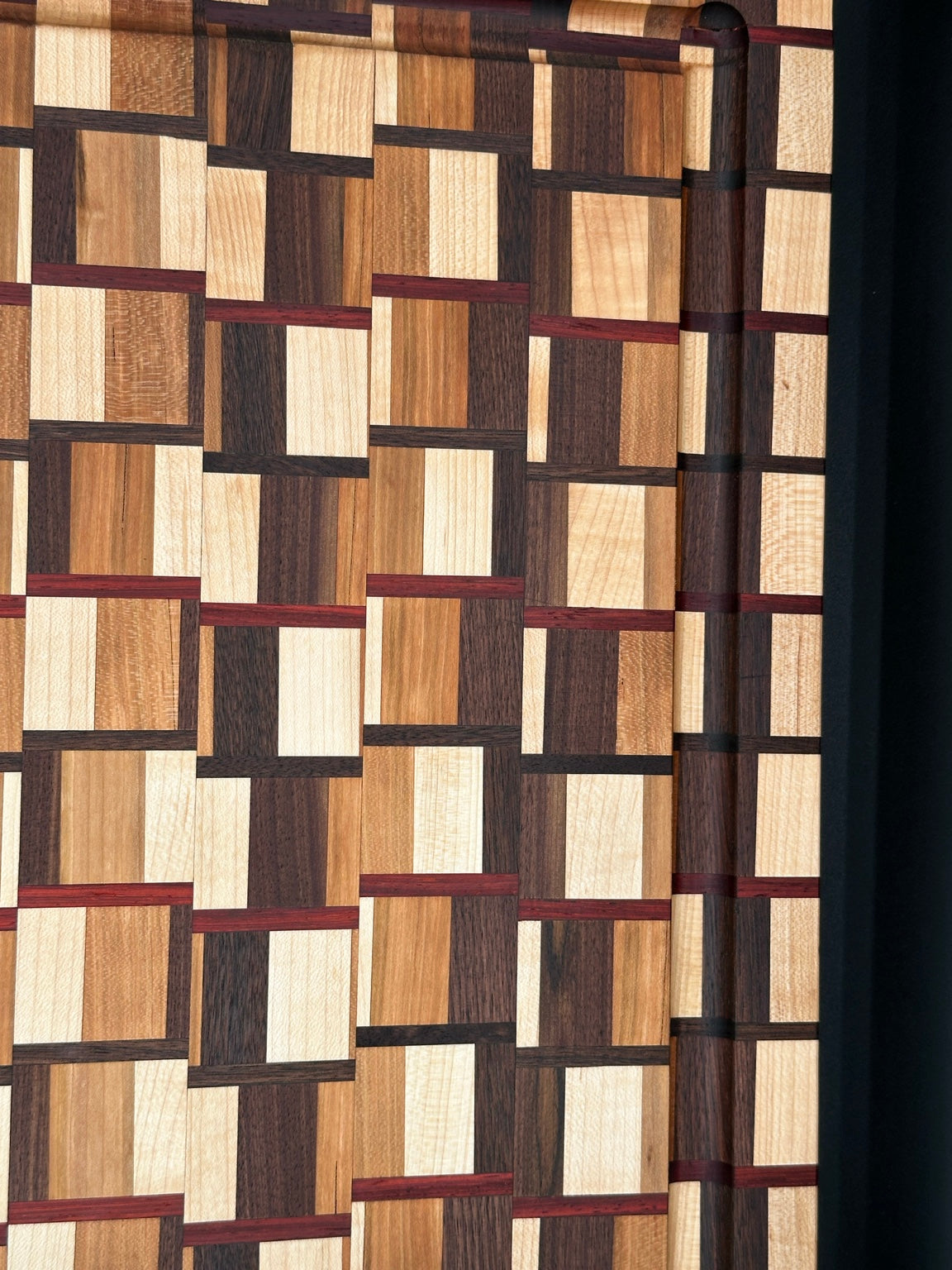 Heritage Weave end-grain cutting board in walnut cherry maple and padauk